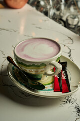 Pink latte with foam heart