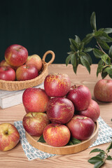 Fresh Red Fuji Apples from Daliangshan Yanyuan Region in Wooden Bowl and Wicker Basket Still Life