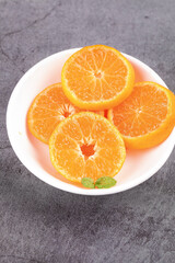 Fresh Sweet Orange Slices on White Plate with Mint Garnish - Healthy Citrus Fruit Food Photography
