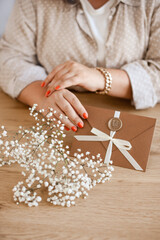 elegant gift certificate an envelope in woman hands with flowers