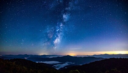 Majestic Milky Way galaxy core over a mountain range landscape. Astrophotography.