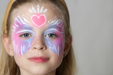 Cute little girl with festival face paint