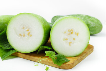 Freshly Sliced Winter Melon on Bamboo Board with Green Leaves - Healthy Asian Vegetable Ingredient