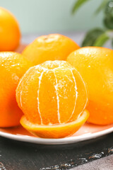 Fresh Peeled Navel Oranges on White Plate - Healthy Citrus Fruit Display