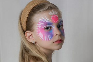 Cute little girl with festival face paint