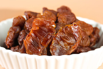 Dried Gaozhou Lychee with Cinnamon Flavor in Bowl - Traditional Chinese Preserved Fruit