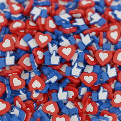 A large pile of social media like and heart icons, closeup view