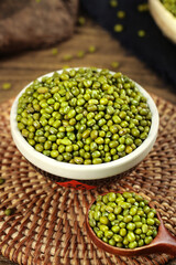 Green Mung Beans in Bowl on Rustic Wicker Mat - Organic Legumes for Healthy Cooking