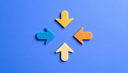 Obraz premium カラフルなフェルト素材の矢印が並ぶシンプルな構図。方向や選択、ビジネスやアイコンに使える抽象イメージ。