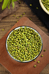 Organic Green Mung Beans in Bowl on Wooden Board - Healthy Legume Food Preparation