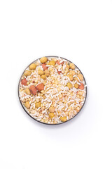 Mixed dried beans soybeans peanuts grains in glass bowl healthy protein ingredients white background