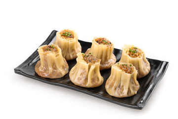 Traditional Cantonese Siu Mai Pork Dumplings on Black Plate - Chinese Dim Sum Delicacy