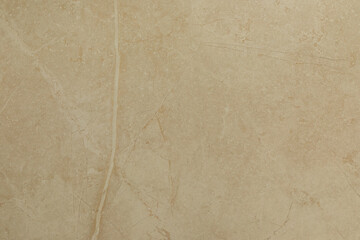 Fototapeta premium Elegant beige textured wall surface with subtle patterns and natural stone feel for interior design projects
