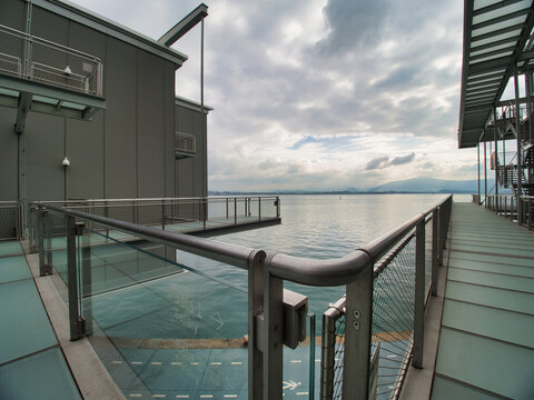 Dramatic Architecture of the Botín Center - A wide-angle, low-view shot of the unique, modern architecture of the Botín Center under a cloudy, dramatic sky.