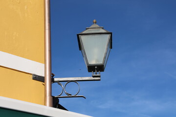 Street lamp on the wall of a house