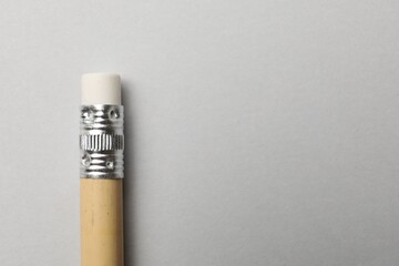 Obraz premium One graphite pencil on grey background, top view. Space for text