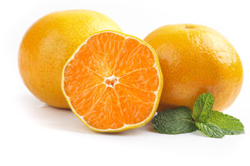 Freshly Picked Ehime Oranges Cut in Half with Mint Leaves on White Background