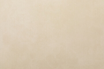 Neutral textured wall surface with subtle variations in color and tone for an inviting backdrop in various settings