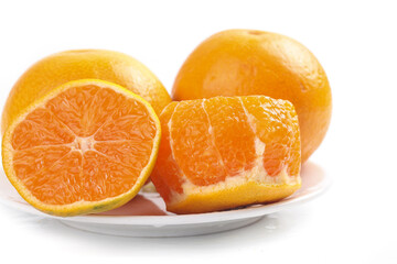 Freshly Cut Oranges on White Plate - Juicy Citrus Fruit Segments Ready to Eat