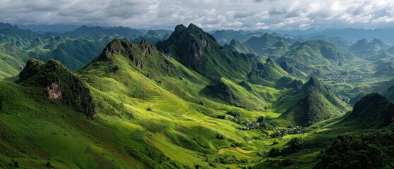 Lush Green Mountain Landscape with Dramatic Clouds and Rolling Hills in the Wilderness