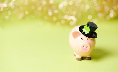 Lucky pig with shamrock on hat, celebrate happy new year, good luck wishes, bokeh lights, background, greeting card or banner