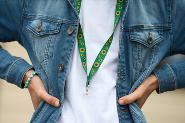 Sunflower lanyard, symbol of people with invisible or hidden disabilities.