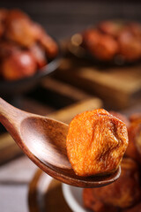 Tree-Ripened Dried Apricot on Wooden Spoon - Natural Air-Dried Fruit Close-Up