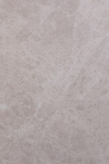 Obraz premium Textured close-up of pale stone surface highlighting natural patterns and colors in afternoon light
