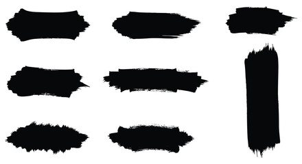 Abstract black brush strokes and splatters on a white background design