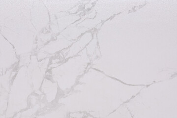 Elegant white marble surface with subtle gray veining creates a modern and stylish backdrop for various decor projects