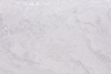 Light gray marble surface with subtle textures and patterns for home decor and design projects