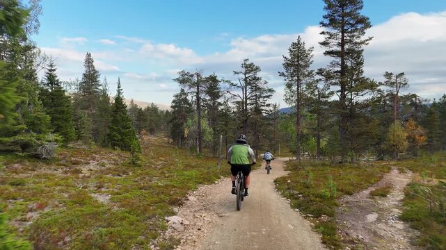 Father and Son Mountain Biking in Autumn, Pallas-Yll&auml;stunturi National Park, Lapland Finland
