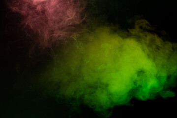 Yellow and green steam on a black background.