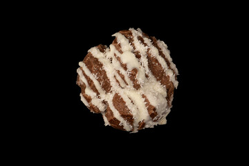 Profiteroles with coconut cream on a black background.