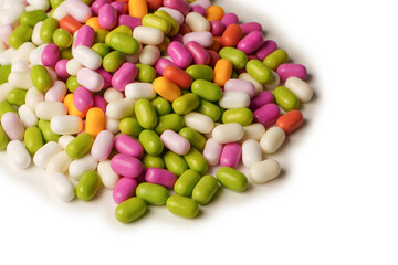 Sweet multicolored candies isolated on white background.