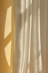 Warm sunlight casting geometric shadows on a soft white curtain and yellow wall.