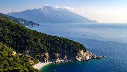 Fototapeta premium A high-angle view of a rugged coastline, lush green hills, and a vast expanse of azure water, showcasing a tranquil and beautiful seaside landscape.