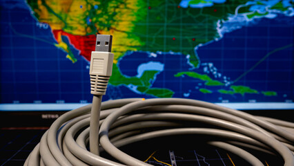 Tornado path leaves massive destruction. Cable connects technology to a geographic map, emphasizing networking and communication.