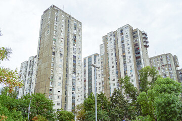Fototapeta premium Belgrade socialist housing architecture: hight concrete apartment buildings in Block 61 district. Yugoslav era residential construction, brutalism in Serbia, architectural heritage of late modernism