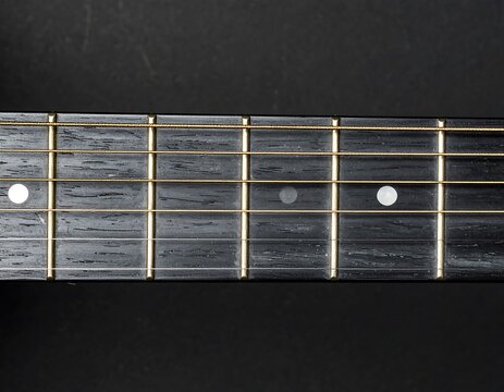 Close-up acoustic guitar fretboard