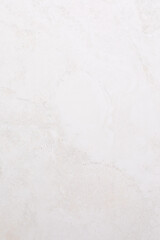 Simple white marble texture with subtle veins and natural patterns showcasing elegance for design projects