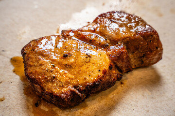 Juicy grilled pork medallions with sauce