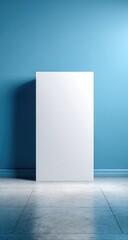 Minimalist blank white canvas against a textured blue wall and tiled floor.