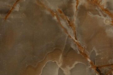 Swirls and veins of earthy tones in a beautiful natural stone texture showcasing rich color variations and patterns