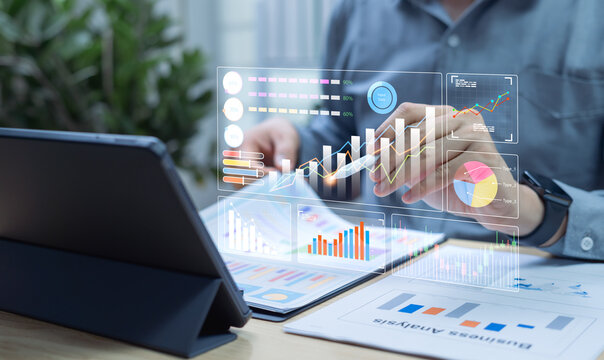Businessman reading online business statistics and chart reports to analyze performance, improve corporate strategy, manage financial and marketing documents, insights for sustainable company growth.