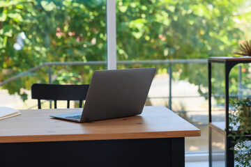 Home workspace. Modern laptop on wooden desk indoors