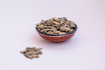 bowl with sunflower seeds isolated on white background