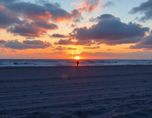 Fototapeta premium Silhouette on Beach at Sunset