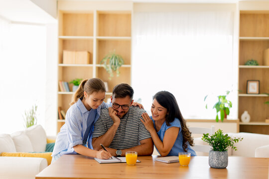 Family bonding moment during a creative brainstorming session at home - Powered by Adobe