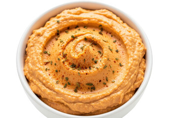 Creamy orange dip swirled in a white bowl isolated on transparent background